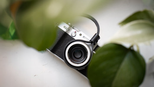 Close-up of a handcrafted camera strap made from Pueblo leather, showcasing its matte, rustic texture and rich patina, ideal for photographers seeking durability and style.