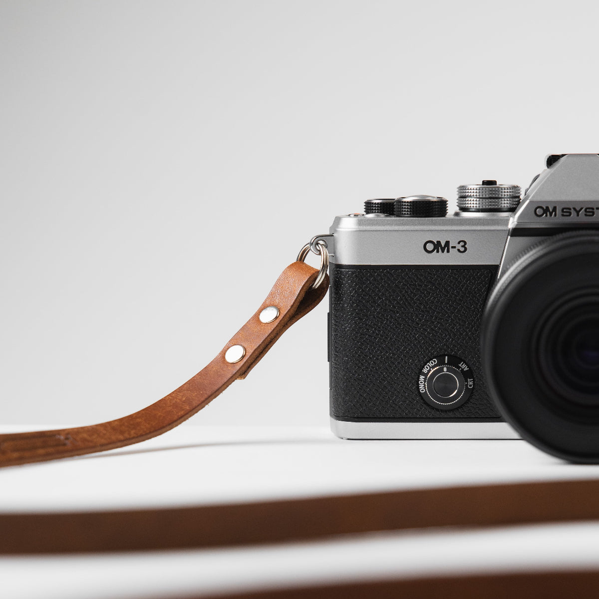 Just launched OM SYSTEM OM-3 camera with walnut brown Arch Appearance leather camera strap