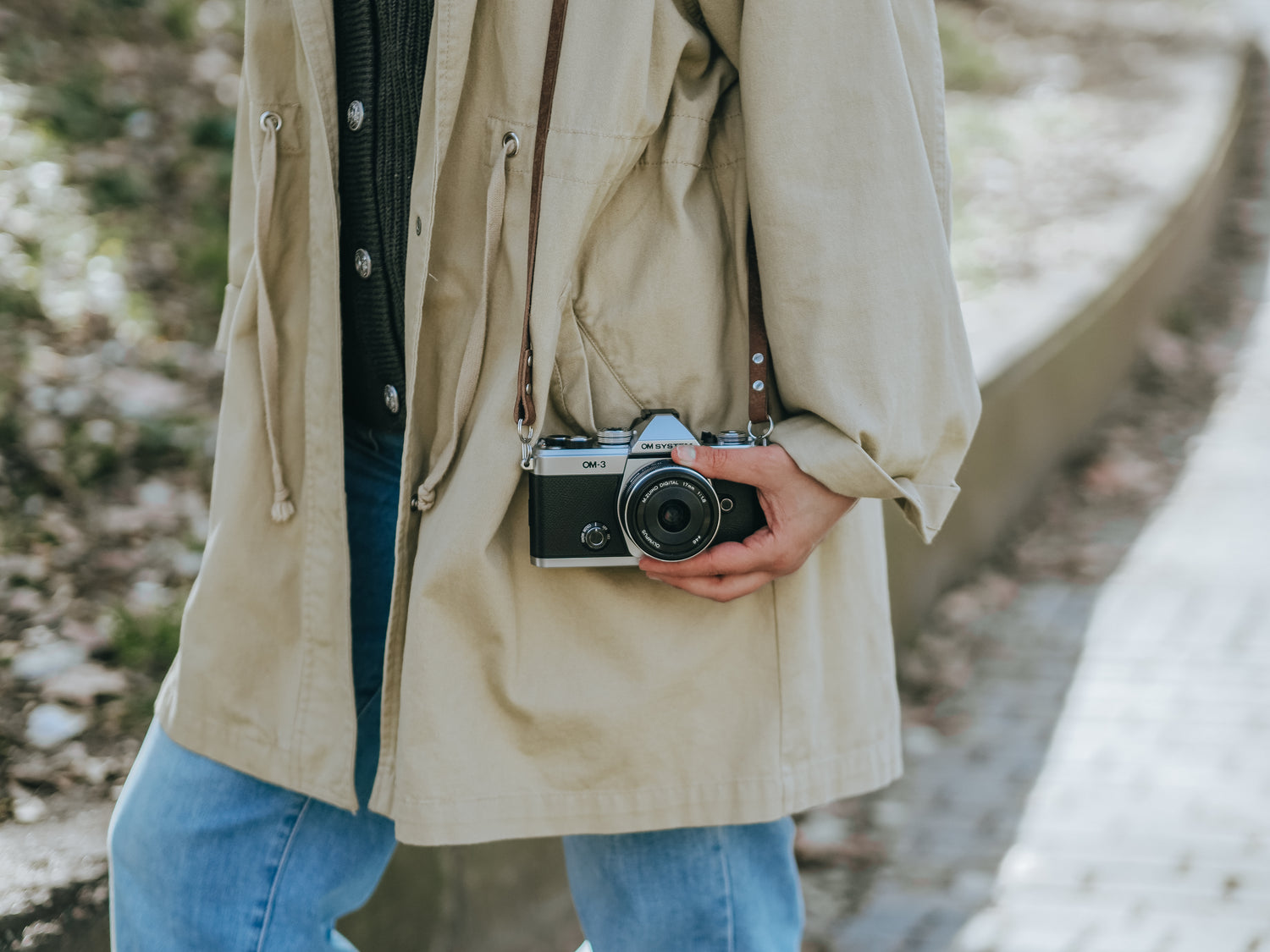 A Person holding new OM System OM-3 camera 